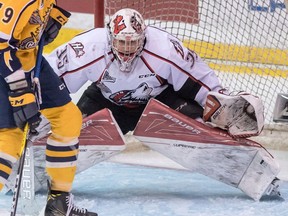 Rouyn-Noranda Huskies goalie Chase Marchand and Shawinigan Cataractes Gabriel Gagne (79) look for the puck during QMJHL President Cup action in Shawinigan, Quebec on Tuesday May 10, 2016.
