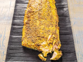 Spices and lemon peel zap up a simple fillet of salmon in this recipe from a new Persian cookbook.