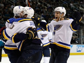 Kyle Brodziak of the St. Louis Blues celebrates  with Carl Gunnarsson and Dmitrij Jaskin after his second goal in game four of the Western Conference Finals against the San Jose Sharks during the 2016 NHL Stanley Cup Playoffs at SAP Center on May 21, 2016, in San Jose.