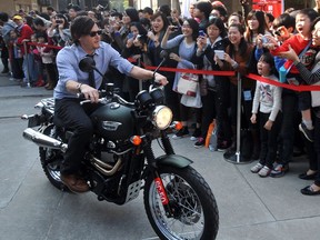 Seen arriving at a media event on a motorcycle in 2013, The Walking Dead's Norman Reedus gets his own show on AMC.
