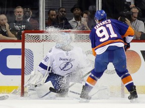 John Tavares of the New York Islanders is stopped during the first period by Ben Bishop of the Tampa Bay Lightning in Game 4 of the Eastern Conference Second Round during the 2016 NHL Stanley Cup Playoffs at the Barclays Center on May 06, 2016, in Brooklyn.
