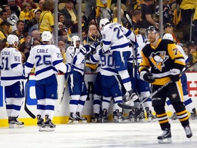 Tyler Johnson No. 9 of the Tampa Bay Lightning celebrates with his teammates after scoring the game winning goal in overtime against Marc-André Fleury of the Pittsburgh Penguins in Game 5 of the Eastern Conference Final with a score of 4 to 3 during the 2016 NHL Stanley Cup Playoffs at Consol Energy Center on May 22, 2016, in Pittsburgh.