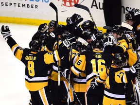 The Pittsburgh Penguins celebrate after defeating the Tampa Bay Lightning 2-1 in Game Seven of the Eastern Conference Final during the 2016 NHL Stanley Cup Playoffs at Consol Energy Center on May 26, 2016 in Pittsburgh, Pennsylvania.