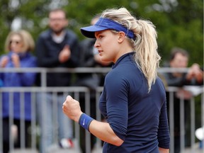 Canada's Eugenie Bouchard celebrates after winning a point against Germany's Laura Siegemund during their women's first round match at the Roland Garros 2016 French Tennis Open in Paris on May 24, 2016. /