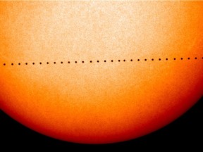 This composite image of observations by NASA and the ESA's Solar and Heliospheric Observatory shows the path of Mercury during its November 2006 transit.
