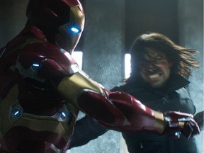 This image released by Disney shows Robert Downey Jr., left, and Sebastian Stan in a scene from Marvel's "Captain America: Civil War," opening in theaters nationwide on May 6, 2016. (Disney/Marvel via AP) ORG XMIT: NYET183