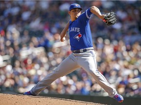 Toronto Blue Jays relief pitcher Roberto Osuna throws to the Minnesota Twins in the ninth inning of a baseball game Sunday, May 22, 2016, in Minneapolis.