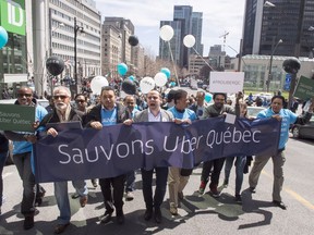 Uber drivers demonstrate against proposed legislation restricting their ride- sharing service Friday, April 29, 2016 in Montreal.