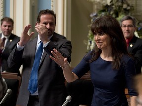 Quebec Minister for Social Services and Youth Protection Veronique Hivon is applauded by members of the legislature after she tabled a legislation on the right to die in dignity, June 12, 2013.