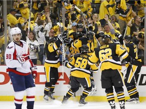 Nick Bonino (#13) of the Pittsburgh Penguins celebrates his game-winning overtime goal against the Washington Capitals in Game Six of the Eastern Conference Second Round during the 2016 NHL Stanley Cup Playoffs at Consol Energy Center on May 10, 2016 in Pittsburgh, Pennsylvania.