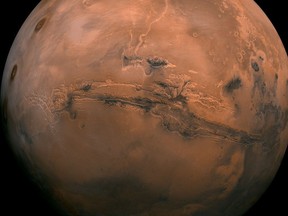 While sky views of Mars won't compare with views like this from visiting spacecrafts, skywatchers will get their best chance to see the Red Planet this month. (Image courtesy of NASA)