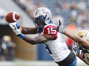 Heading into training camp, the Alouettes are loaded with receivers, including S.J. Green, above, battling Bombers' Johnny Adams last season. Joining Green are Duron Carter, Kenny Stafford, Samuel Giguère, B.J. Cunningham, Nik Lewis and Cody Hoffman.