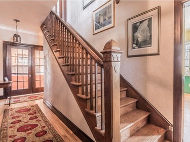 Wooden staircase leading to second floor at 498 Lakeshore Rd. in Beaconsfield. (Photo by Liam Callou courtesy M Immobilier)