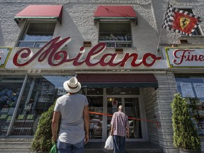 Customers arrive to find a closed Milano grocery store in Little Italy on Sunday, June 26, 2016. The store was damaged by fire on Saturday.