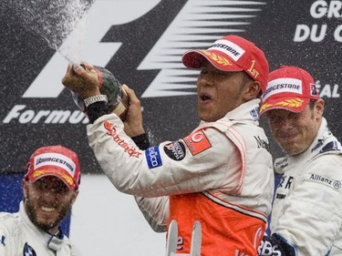 McLaren's Lewis Hamilton (C) won the 2007 Canadian Grand Prix. It was Hamilton's first F1 win and his 6th podium finish that year. It was also a podium first for both BMW's Nick Heidfeld (2nd place - L) and Williams' Alex Wurz (3rd place).
