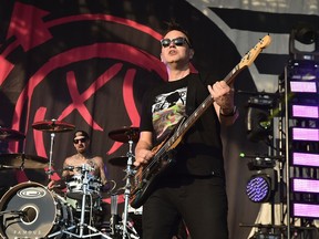 Travis Barker, left, and Mark Hoppus of Blink-182 perform at the Firefly Music Festival on June 19, 2016 in Delaware.