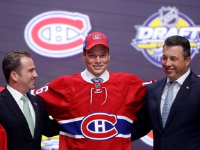 Mikhail Sergachev celebrates with the Montreal Canadiens after being selected ninth overall during round one of the 2016 NHL Draft on June 24, in Buffalo, New York.