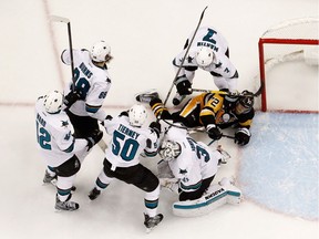 Patric Hornqvist of the Pittsburgh Penguins is checked into a group of San Jose Sharks in Game 5 of the Stanley Cup final on June 9, 2016 in Pittsburgh. For Gordie Howe to make his exit during the height of the annual struggle for the trophy was entirely appropriate.