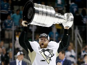 Phil Kessel of the Pittsburgh Penguins celebrates with the Stanley Cup after their 3-1 victory to win the Stanley Cup against the San Jose Sharks in Game Six of the 2016 NHL Stanley Cup Final at SAP Center on June 12, 2016 in San Jose, California.