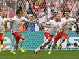 Poland's midfielder Jakub Blaszczykowski (R) celebrates after scoring during the Euro 2016 group C football match between Ukraine and Poland at the Velodrome stadium in Marseille on June 21, 2016.