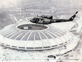 A Canadian Armed Forces helicopter flies over the Olympic Park in Montreal as part of security precautions for the 1976 Olympic Games. No flights within three miles of the stadium were allowed once the Games began.