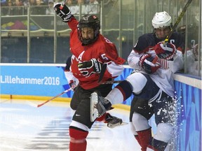 Benoit-Olivier Groulx of Canada, left, crashes into Mattias Samuelsson of USA during their Ice Hockey men's final between Canada and USA at the Kristins Hall during the Winter Youth Olympic Games, Lillehammer, Norway, Sudnay Feb. 21, 2016. Benoit-Olivier Groulx, son of former Gatineau Olympiques coach Benoit Groulx, is the top-rated player for the Quebec Major Junior Hockey League draft on June 4 in Charlottetown.