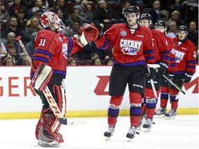 Logan Brown, right, greeting goalie Zach Sawchenko during the CHL Top Prospects Game on Jan. 28, 2016 in Vancouver, had 21 goals and 74 points in 59 games last season for the Windsor Spitfires.