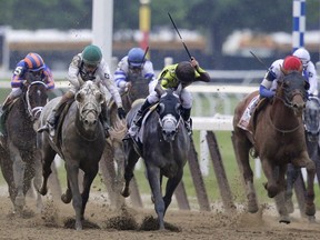 Creator, second from left, with jockey Irad Ortiz Jr., battles Destin, centre, with jockey Javier Castellano, down the stretch in the 148th running of the Belmont Stakes horse race, Saturday, June 11, 2016, in Elmont, N.Y. Creator won the race. Governor Malibu, with jockey Joel Rosario is at right.
