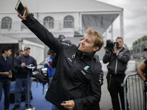 Mercedes F1 driver Nico Rosberg takes a selfie during the open house for the Formula One Canadian Grand Prix at the Circuit Gilles-Villeneuve in Montreal on Thursday, June 9, 2016.
