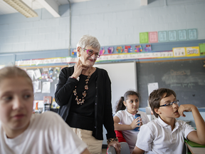Merton School principal Raizel Candib, who will be retiring this year after 47 years in education, listens to best wishes from students in a classroom at the elementary school in Montreal on Tuesday, June 14, 2016.