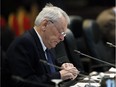 In this Nov. 18, 2015, file photo, Dick Pound, the author of a report that detailed anti-doping corruption in Russia, prepares during a break in a meeting of the World Anti-Doping Agency in Colorado Springs, Colo.