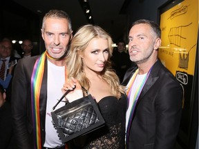 Paris Hilton, seen here June 17, 2016 with Dsquared2's Dean and Dan Caten in Milan, Italy, will be at Pointe Calumet Beachclub on Saturday, June 25, 2016.