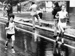 East Germany's Waldemar Cierpinski finds he has a companion joining him during his run for gold in the marathon at the Montreal Olympics in 1976.