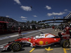 Ferrari Formula One driver Sebastian Vettel leaves the garage during the second practice session for the Formula One Canadian Grand Prix at the Circuit Gilles-Villeneuve in Montreal on Friday, June 10, 2016.