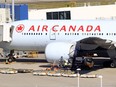 An Air Canada plane sits at a gate at the Sydney Airport in Sydney, Australia.