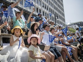 People watching the Fête Nationale parade on June 24, 2016.