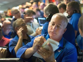 Traders fill orders in the Standard & Poor's 500 stock index options pit at the Chicago Board Options Exchange.