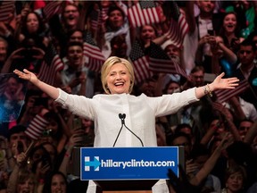 Democratic presidential candidate Hillary Clinton arrives onstage during a primary night rally at the Duggal Greenhouse in the Brooklyn Navy Yard, June 7, 2016 in the Brooklyn borough of New York City. Clinton has secured enough delegates and commitments from superdelegates to become the Democratic Party's presumptive presidential nominee.