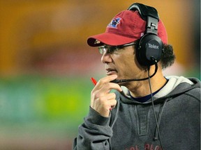 In this Sept. 29, 2012 photo, Montreal Alouettes head coach Marc Trestman talks into his headset during the final minutes of a Canadian Football League game against the Hamilton Tiger-Cats in Hamilton. The Alouettes will honour former coach Marc Trestman at halftime of Montreal's regular season home game against the Winnipeg Blue Bombers at Percival Molson Stadium on Friday.