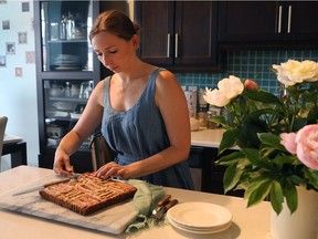 Janice Lawandi with her Rhubarb Pumpkin Seed Cake, which is moist and full of rhubarb chunks.