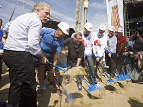 Quebec Liberal Party Leader Jean Charest, from the left, Mario Bedard of J'ai ma Place, Quebec City mayor Régis Labeaume, hockey legends Peter Stastny, Michel Goulet and Marc Tardif at the ground breaking ceremony for the new NHL-size arena Monday, September 3, 2012 in Quebec City.