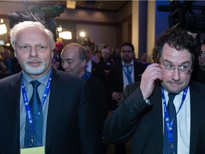 Jean-François Lisée, left, and Bernard Drainville on election night 2014:  Lisée says his policy on religion in the public workplace will be more gradual than Drainville's proposed charter of values.