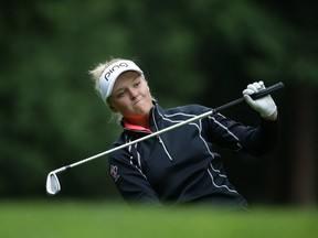 Brooke Henderson of Canada reacts after hitting her second shot on the 14th hole during the third round of the KPMG Women's PGA Championship at the Sahalee Country Club on June 11, 2016, in Sammamish, Washington.