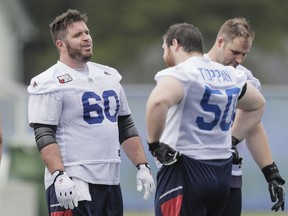 LENNOXVILLE, QUE.: MAY 29, 2016 -- Centre Dominic Picard, left, takes part in the Montreal Alouettes training camp at Bishop's University in Lennoxville on Sunday, May 29, 2016. (Dario Ayala / Montreal Gazette) ORG XMIT: 56290
