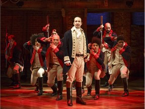 This image released by The Public Theater shows Lin-Manuel Miranda, foreground, with the cast during a performance of "Hamilton," in New York.  (Joan Marcus/The Public Theater via AP) ORG XMIT: NYET109