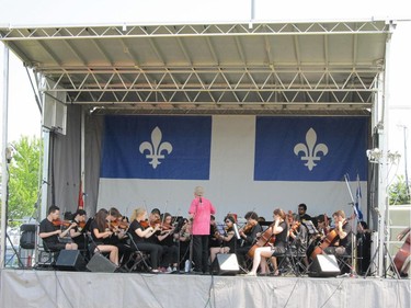 Listening to the W.I. Youth Orchestra at Bourgeau Park. Photo by Madeleine Davidson.