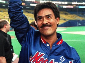 Montreal Expos pitcher Dennis Martinez tips his cap to the crowd after getting his 200th career win against the Atlanta Braves in Montreal, June 18, 1993. Pat Hentgen, the first Toronto Blue Jay to win the Cy Young Award, and Martinez, who pitched a perfect game while with the Montreal Expos, headline the 2016 class named for induction into the Canadian Baseball Hall of Fame.THE CANADIAN PRESS/Ryan Remiorz