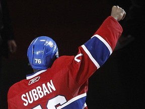 Montreal Canadiens defenseman P.K. Subban raises his fist to the crowd following his first stat of game following the Habs win in overtime over Chicago Blackhawks in NHL action in Montreal on Tuesday April 05, 2011.