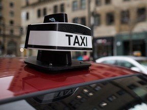 The logo of a taxi parked on de Maisonneuve Blvd. near the corner of Stanley St. in Montreal on Monday, April 18, 2016. .jpg