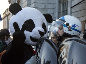 Anarchopanda makes an appearance at city hall during a demonstration against Montreal's anti-protest law.